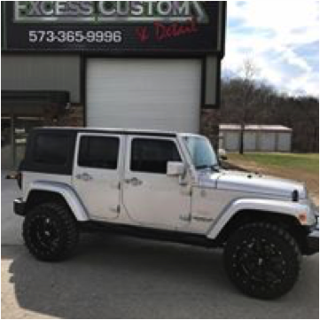 Jeep parked in front Excess Customz Store